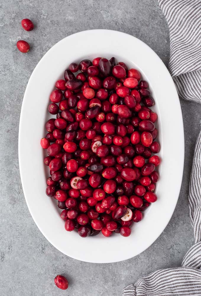 Oval plate filled with fresh cranberries