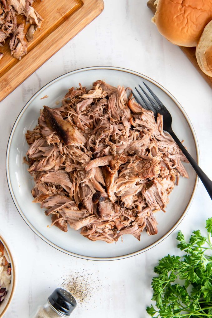 Slow cooker pulled pork on a white plate