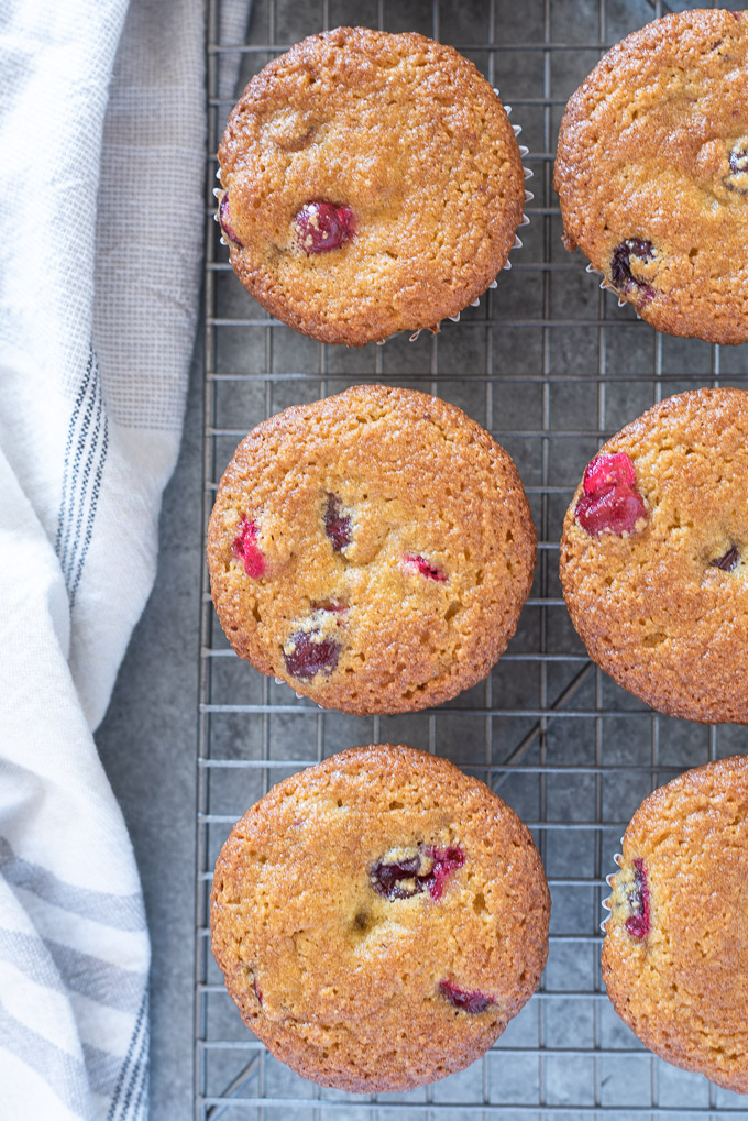 Healthy cranberry orange muffins cooling on a wire rack