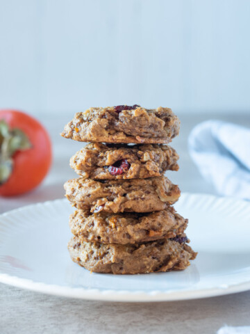 Stack of persimmon cookies on a white plate