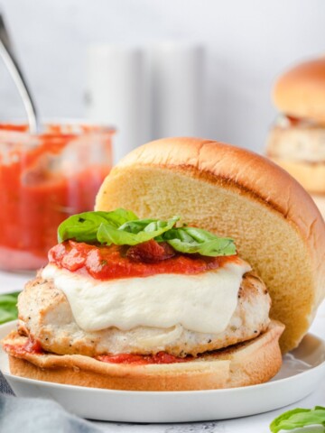Ground chicken burger with marinara, mozzarella and basil