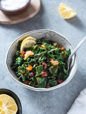 Bowl of sautéed swiss chard with lemon