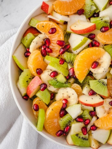 Winter fruit salad in a white bowl