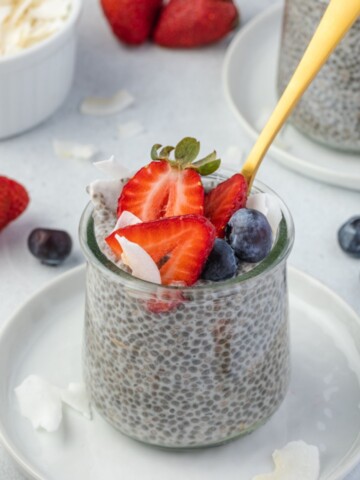 Chia seed pudding in a jar with a spoon digging in