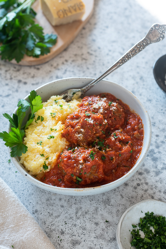 Instant pot polenta topped with meatballs