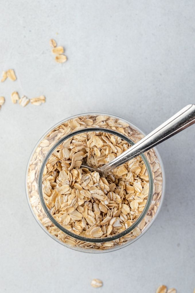 Rolled oats in a jar with a spoon