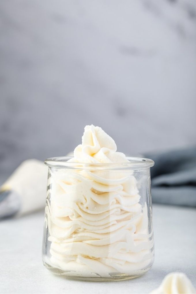 Stabiized whipped cream piped into a jar