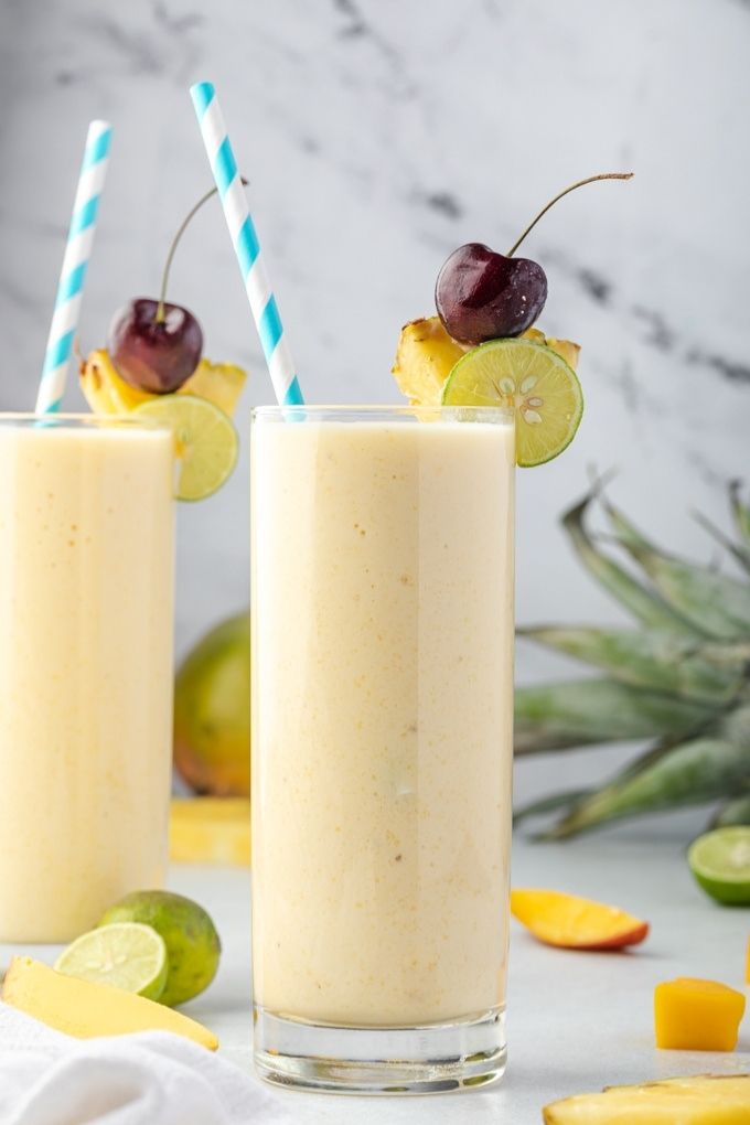 Tropical smoothies with blue and white striped straws