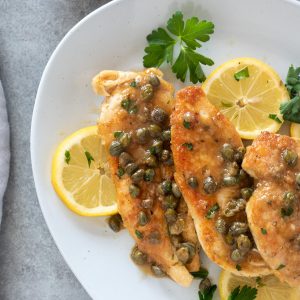 Chicken piccata on a serving plate