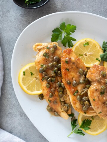 Chicken piccata on a serving plate