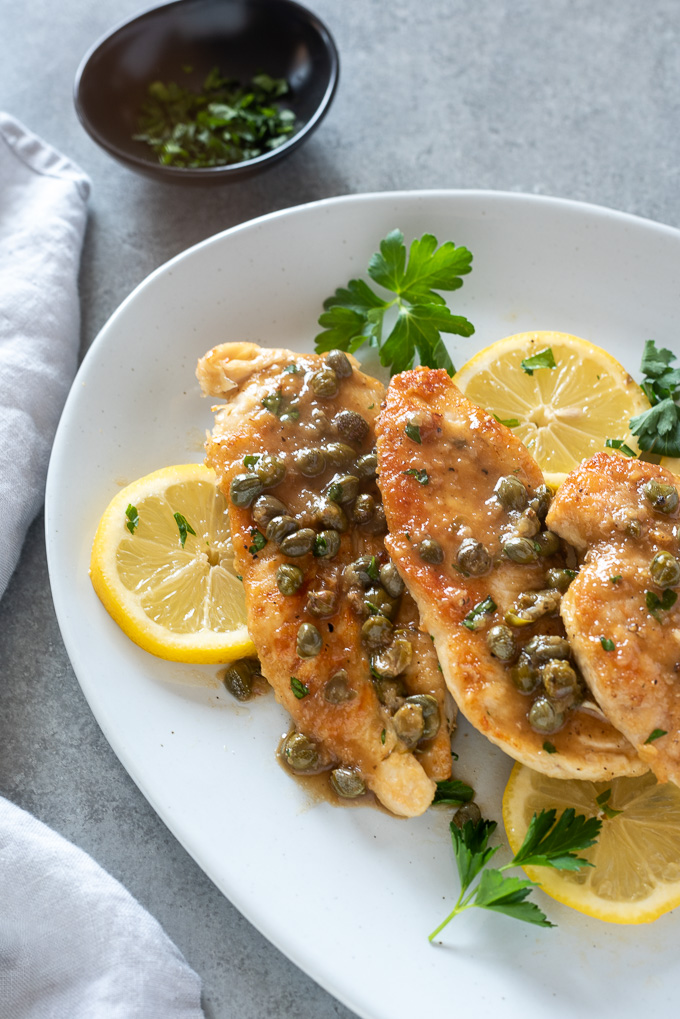 Chicken piccata smothered in a lemon caper butter sauce