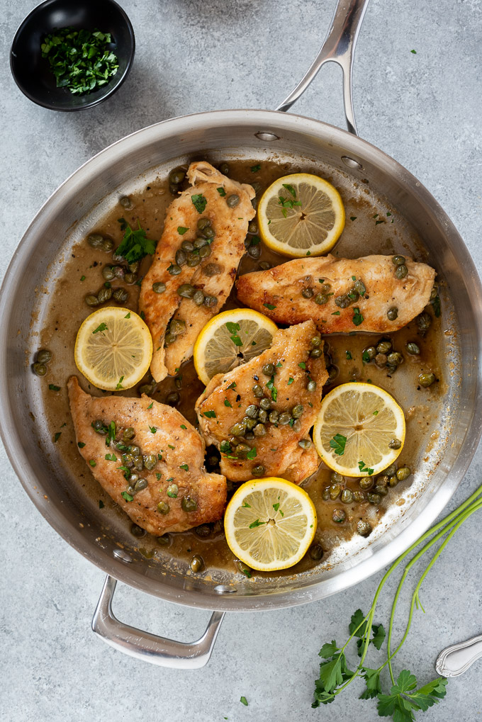 Chicken piccata in the pan with lemon