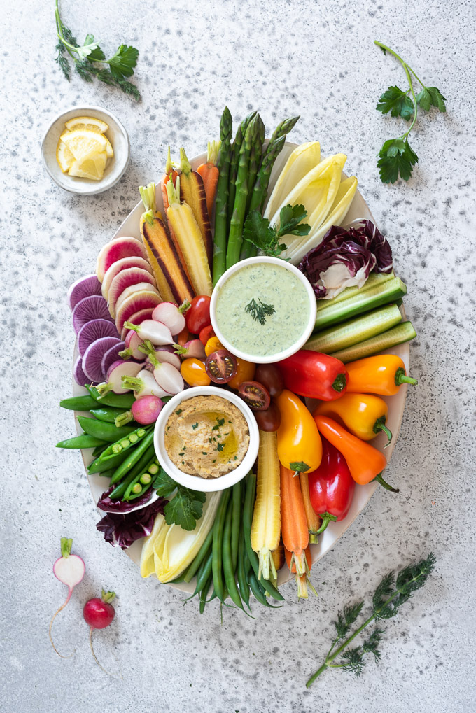 Crudités platter with veggies, dips and herbs