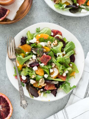 Roasted beet salad on a plate with a fork