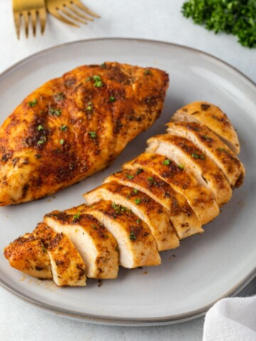 Air fryer chicken breast sliced on a plate