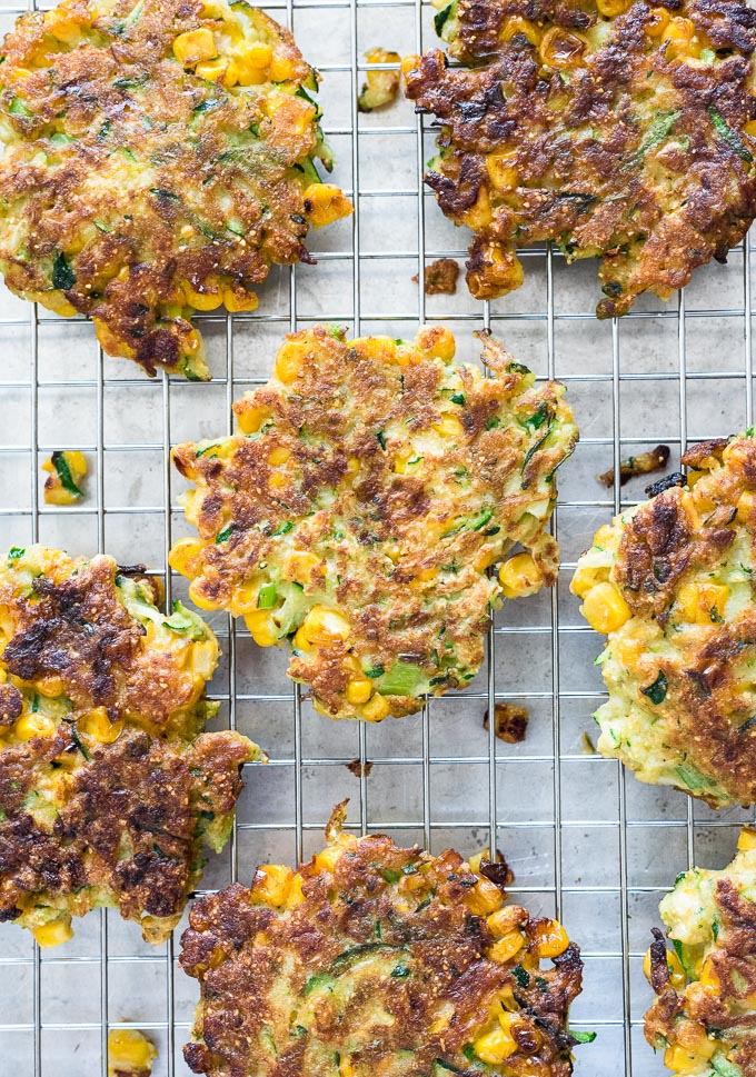 Zucchini and corn fritters on a wire rack