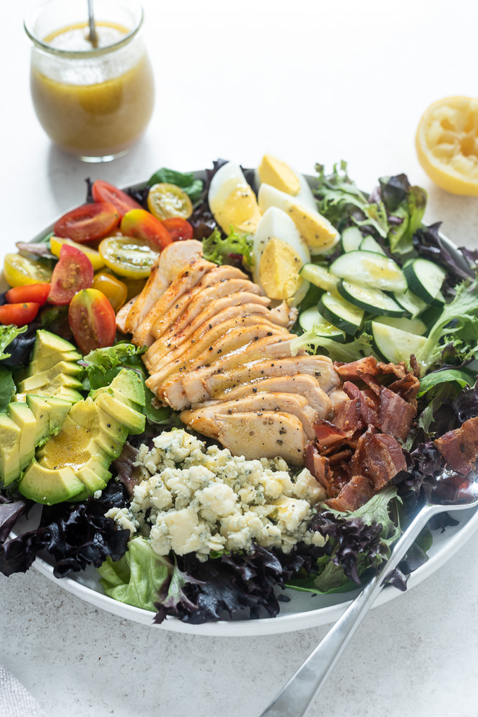 Cobb salad with chicken in a white bowl