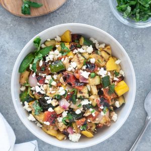 Bowl of grilled vegetable salad with linen