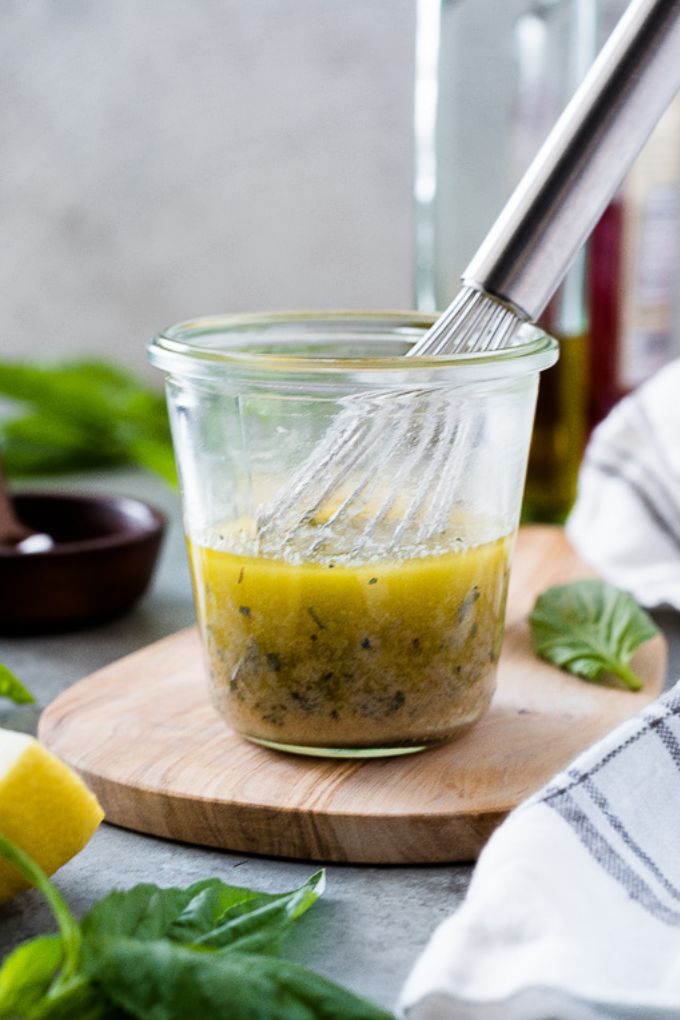 Vinaigrette in a jar with a whisk