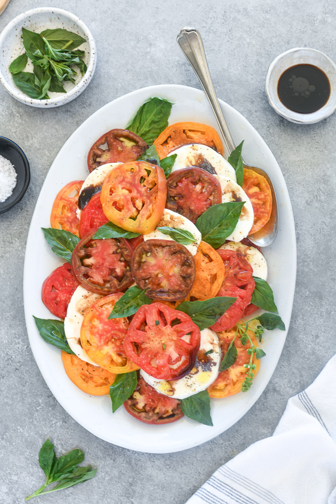 Caprese salad with balsamic vinegar drizzled over the top