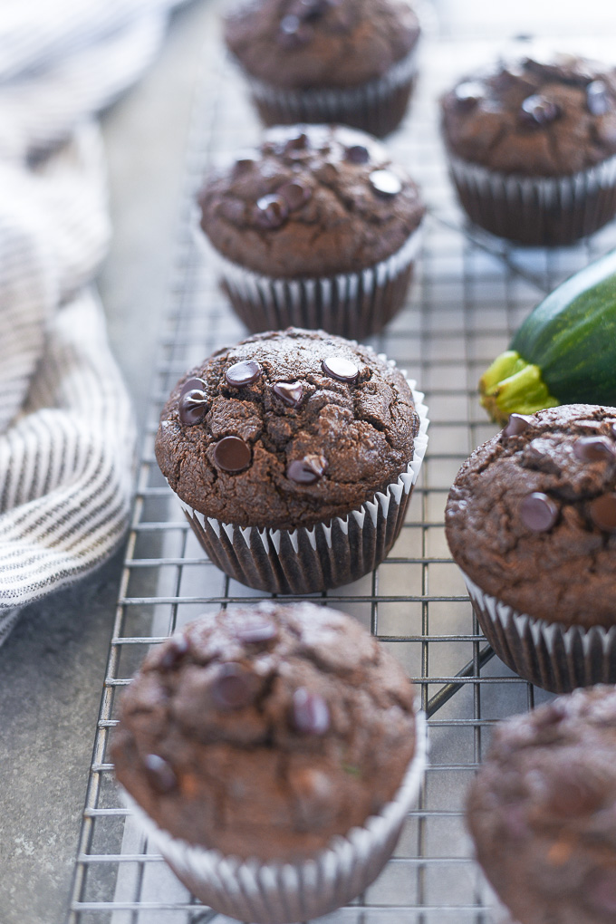 Healthy chocolate zucchini muffins on a wire rack