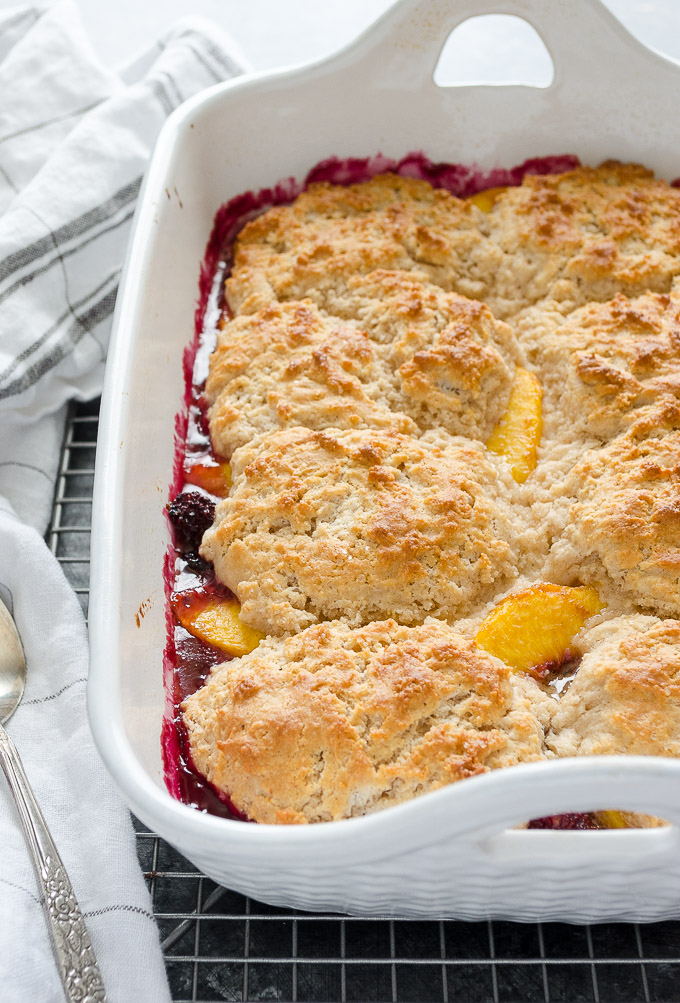 Peach and blackberry cobbler cooling on a wire rack