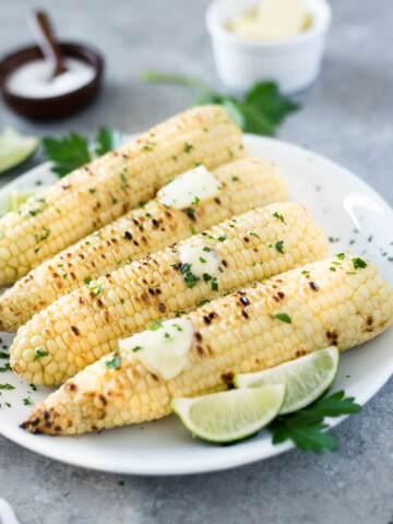 Grilled corn on the cob with butter and lime