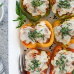 Italian stuffed peppers on a white serving platter