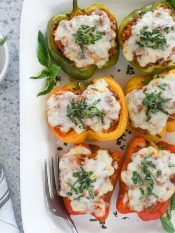 Italian stuffed peppers on a white serving platter