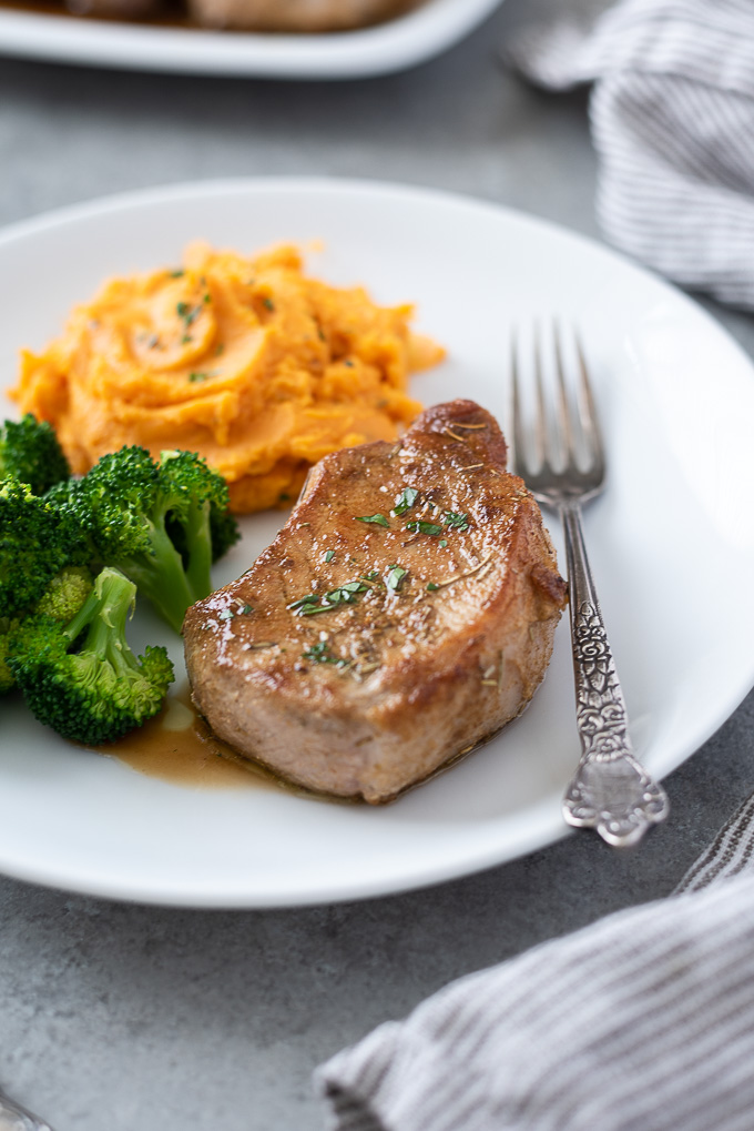 Baked pork chops with mashed potatoes and broccoli