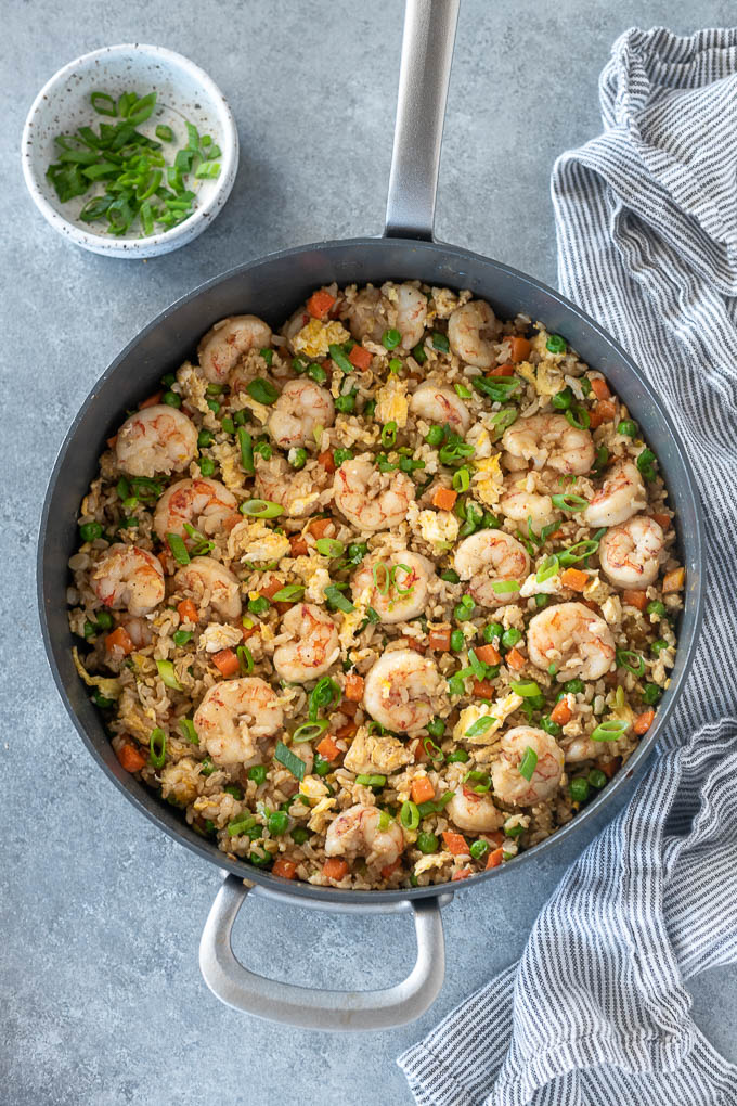 Pan of shrimp fried rice with scallions