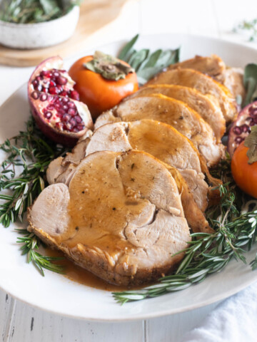 Boneless turkey breast sliced and covered with gravy