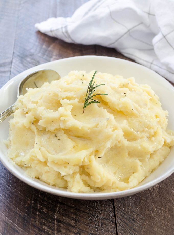 Crock pot mashed potatoes in a white bowl