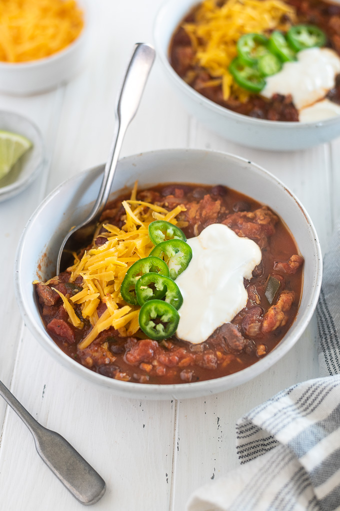 Crock pot turkey chili in a bowl with toppings