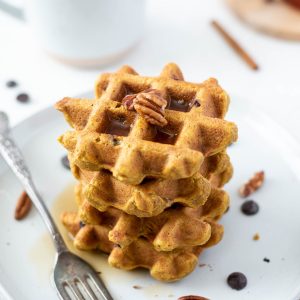 Stack of healthy pumpkin waffles on a plate