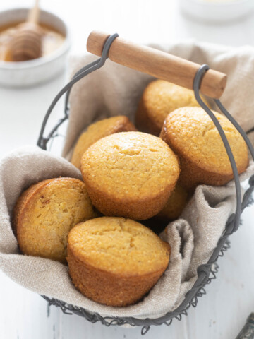 Honey cornbread muffins in a basket