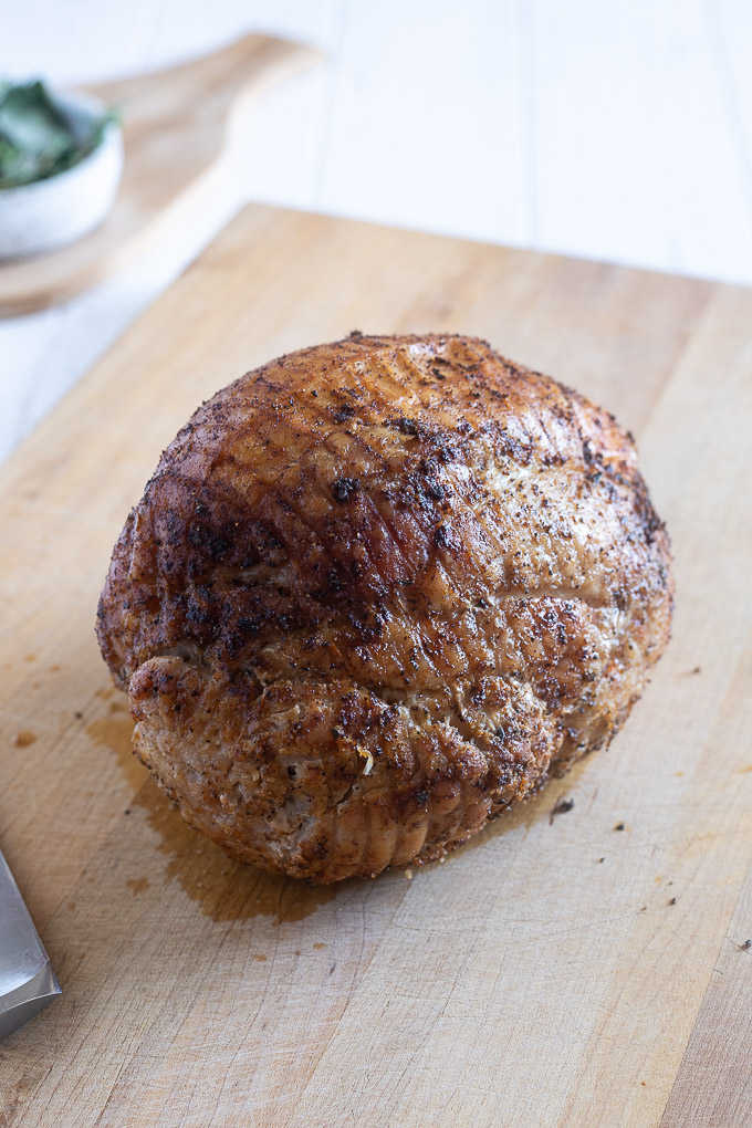 Roasted boneless turkey breast on a cutting board