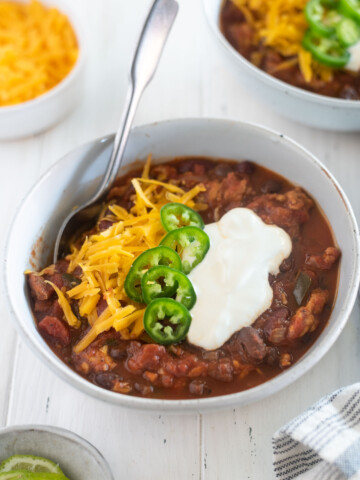 Slow cooker turkey chili in a bowl with toppings