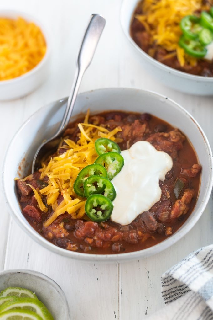 Slow cooker turkey chili in a bowl with toppings