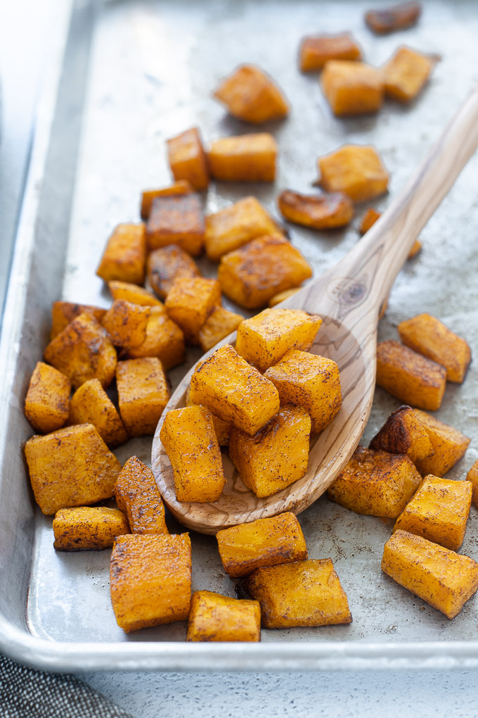 Oven roasted butternut squash in a wooden spoon