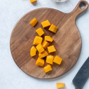 Cubed butternut squash on a cutting board