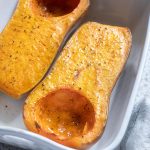 Roasted whole butternut squash in a baking dish
