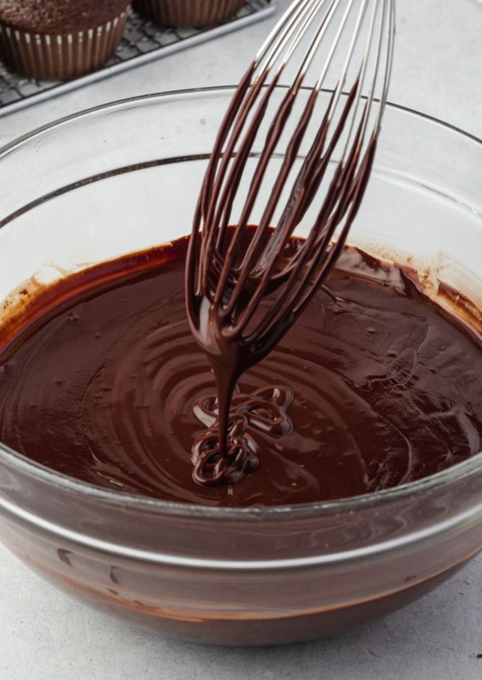 Easy chocolate ganache drizzling off a whisk