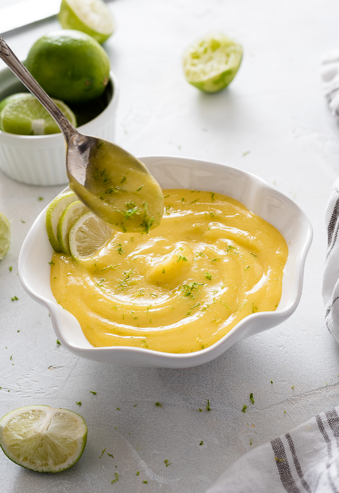 Spoon over a bowl of lime curd