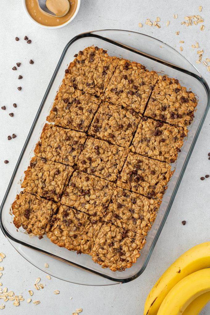 Peanut butter oat bars cut into squares in baking dish