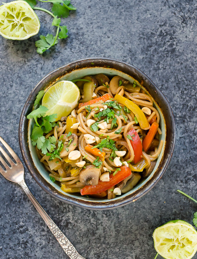 Thai spaghetti in a bowl with lime and peanuts