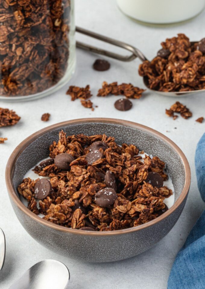 Chocolate granola in a bowl with milk