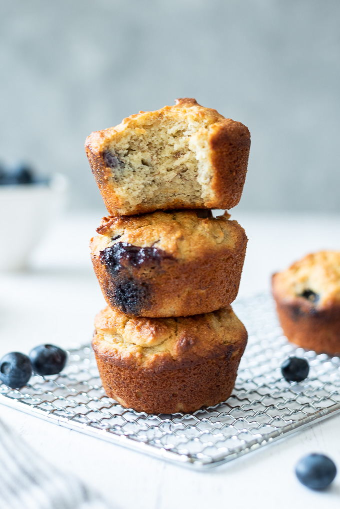 Stack of almond flour banana muffins with blueberries