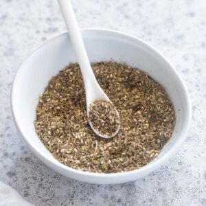 Za'atar seasoning in a bowl with a spoon