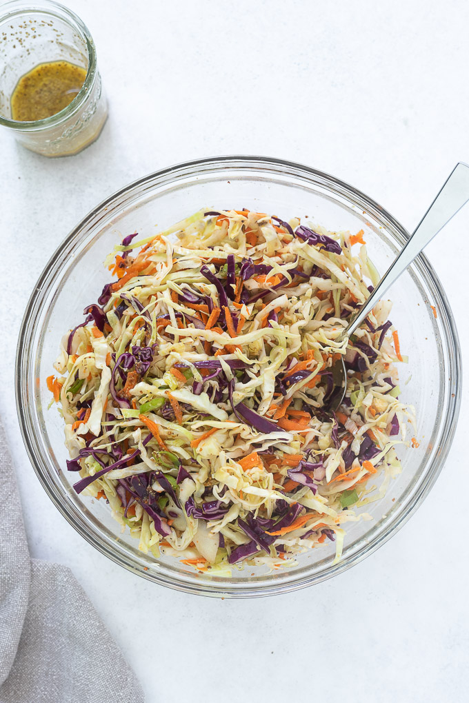 No mayo coleslaw dressing in a glass bowl